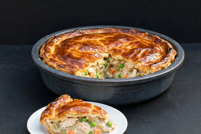 Classic Chicken Pot Pie (Buttery Crust, Creamy Filling, Made From Scratch) 4 Chicken pot pie featured image, whole baked pie with one slice cut, styled for the article thumbnail
