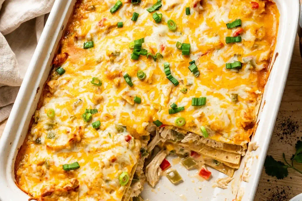 10 Best Chicken Casserole Recipes for Easy Weeknight Dinners 8 King Ranch Chicken Casserole with a cut corner showing the tortilla layers, from this chicken casserole roundu
